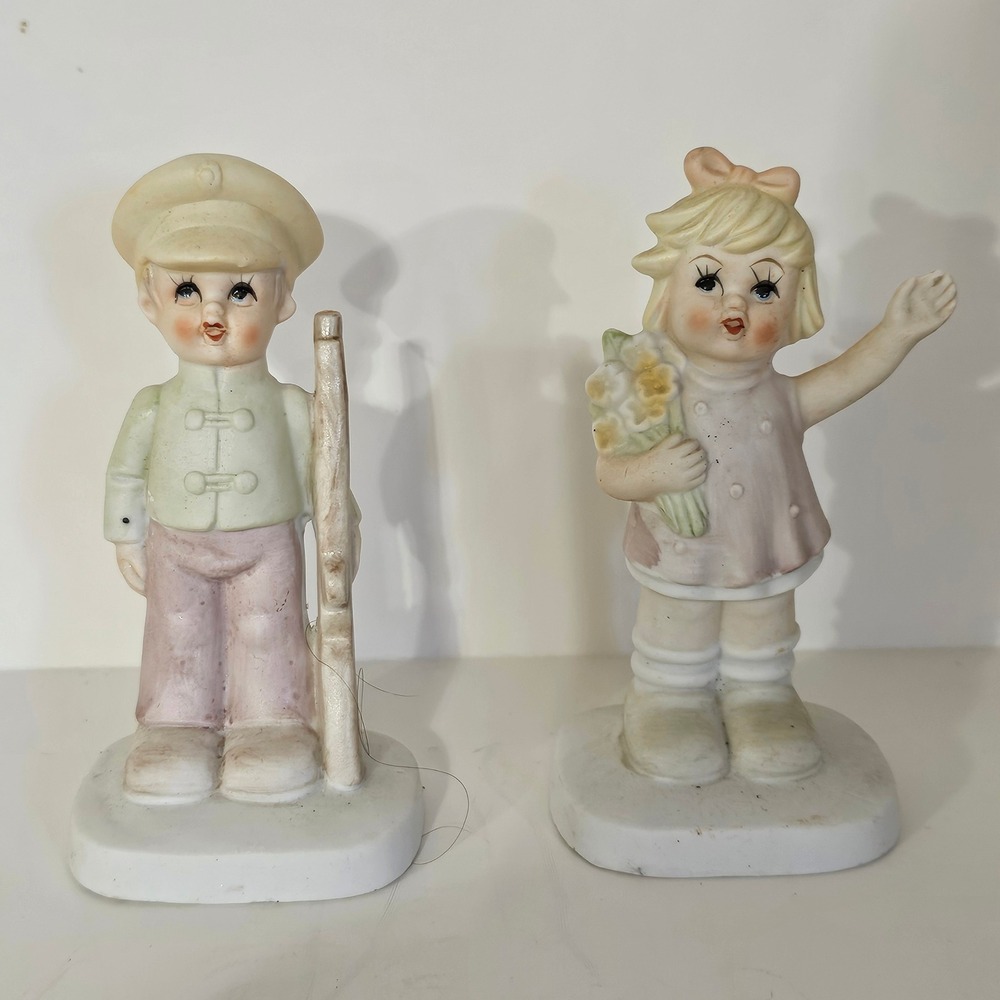 Vintage Matte Porcelain Boy with Rifle and Girl with Flowers Figurines Set of 2